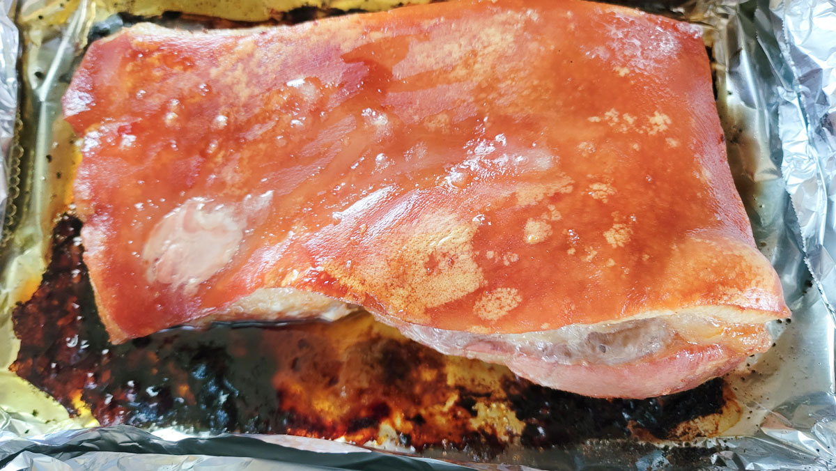 Browned skin on the pork belly.
