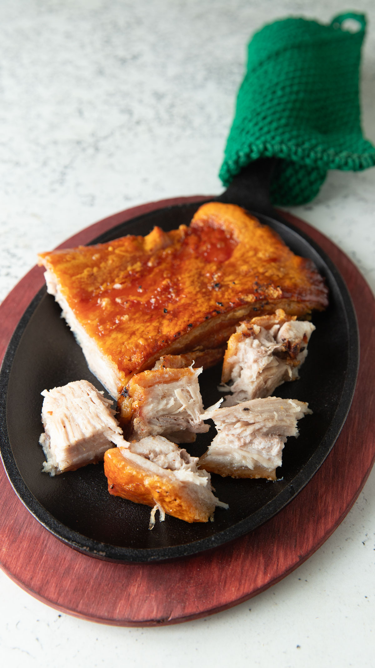 Chunk of pork belly cut into wedges.