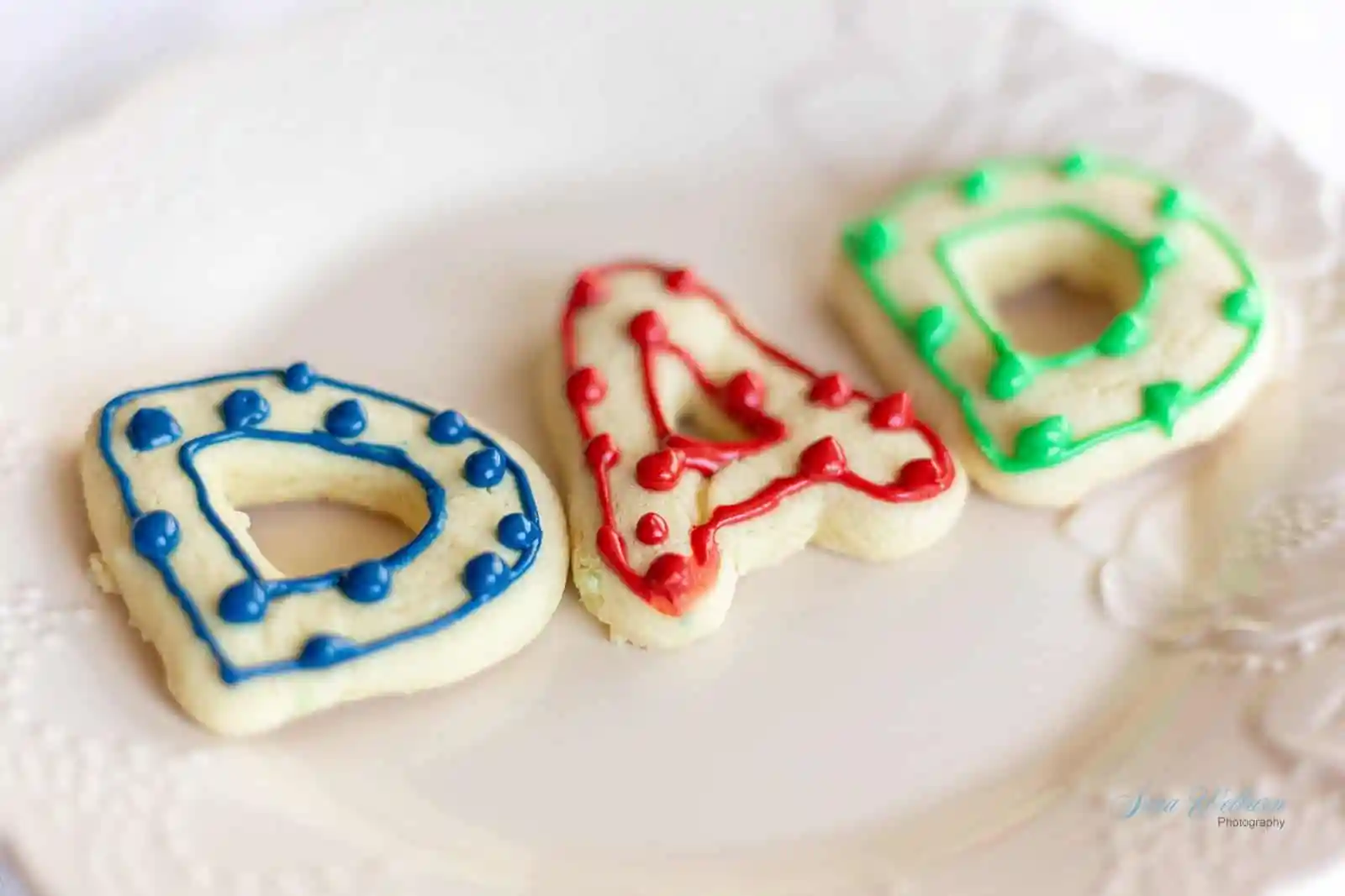 Cut out cookies that spell Dad.