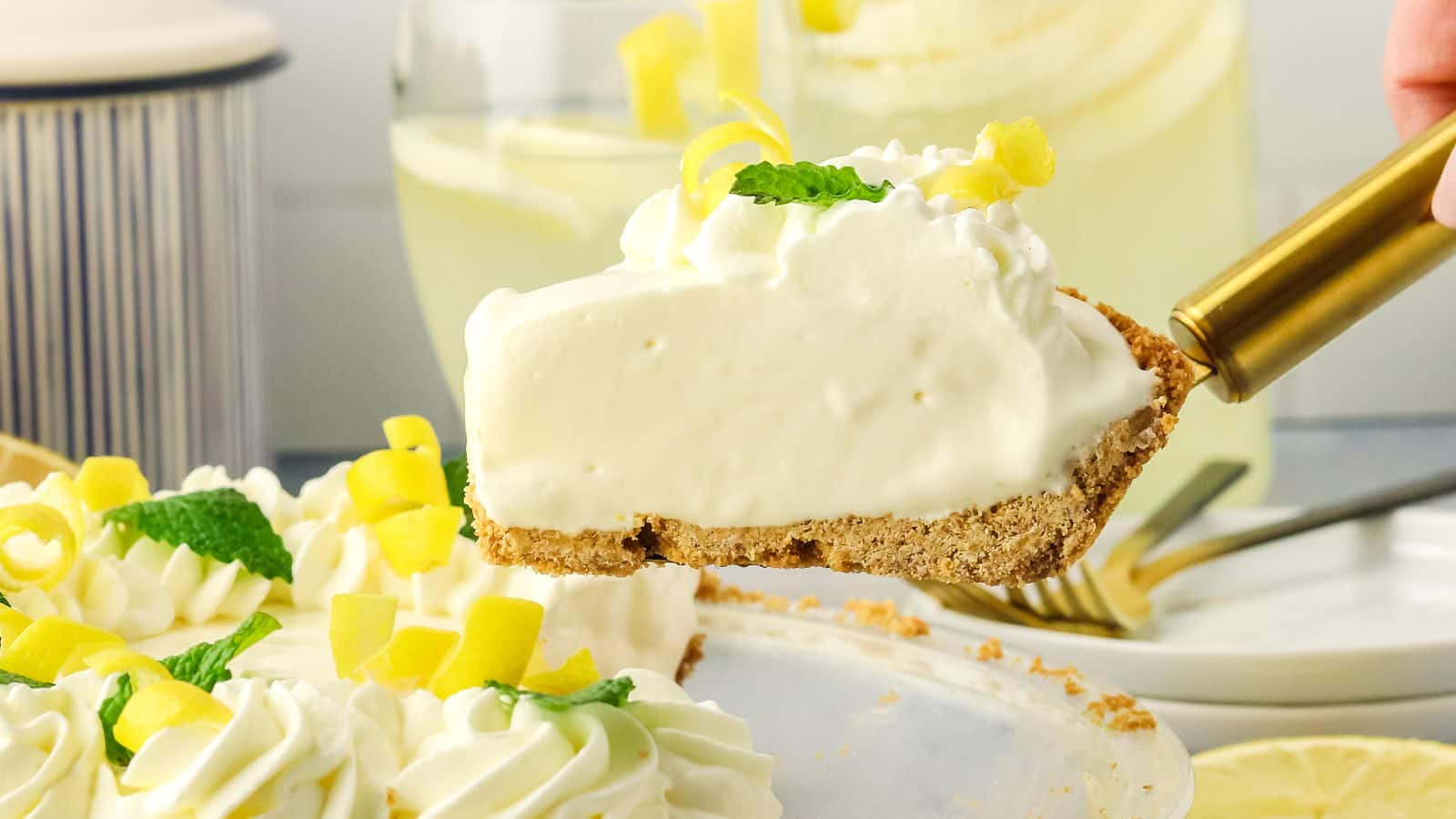 Slice of lemon pie on a pie server.