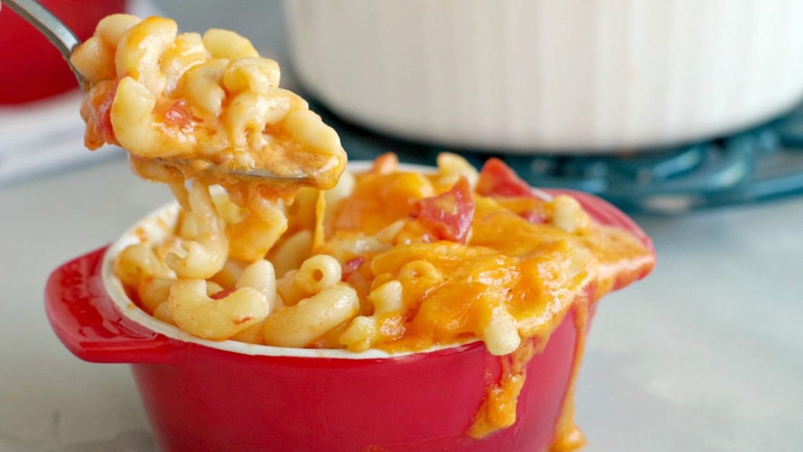 Macaroni and cheese in a red bowl.