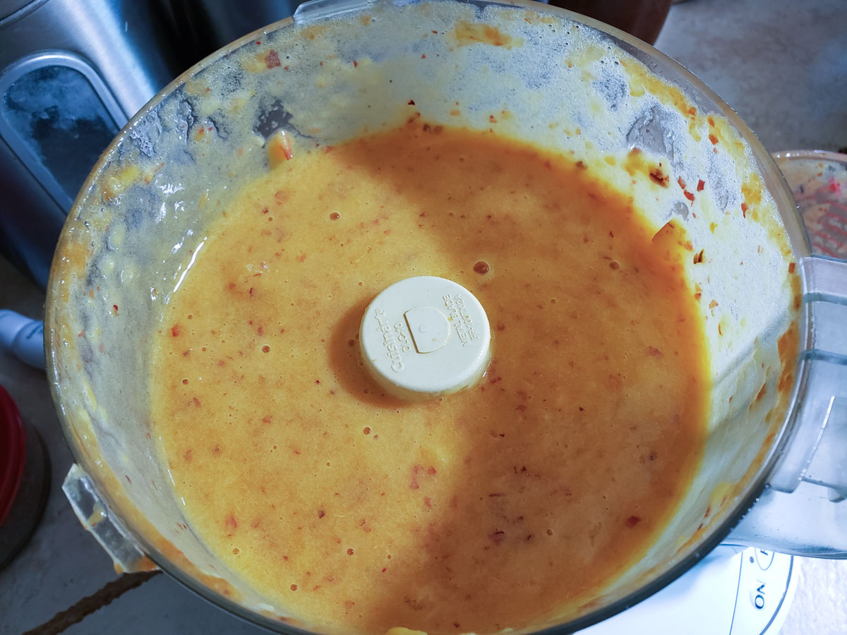 Processed peaches in the food processor bowl.