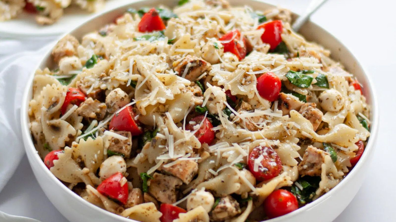 Pesto pasta salad in a bowl.