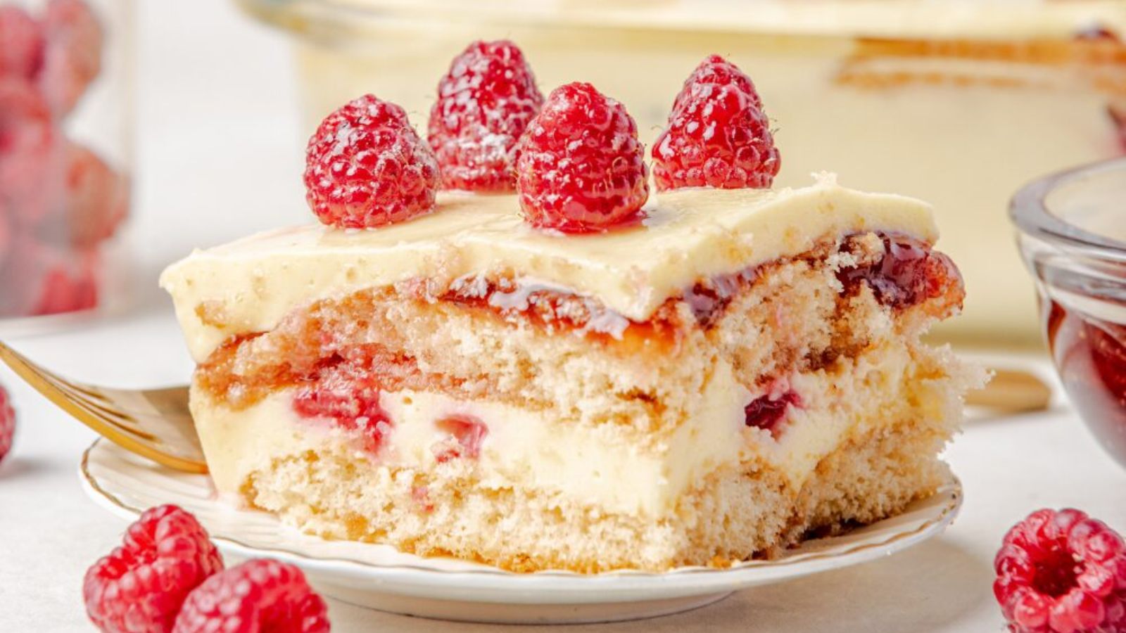 Slice of raspberry tiramisu on a plate.