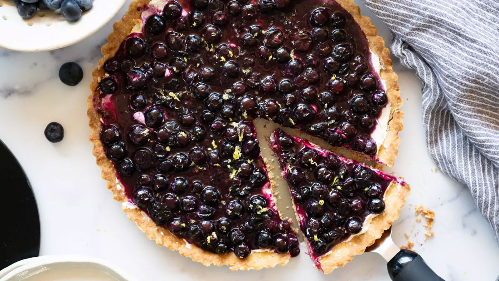 Piece cut our of a blueberry tart.