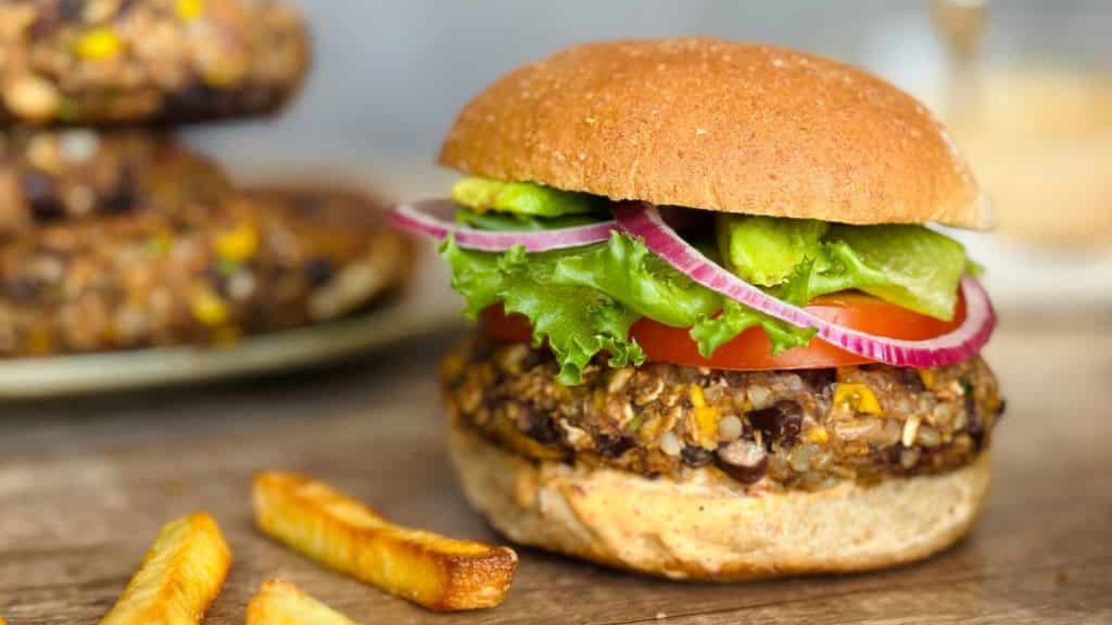 Black bean burger with potatoes on the side.