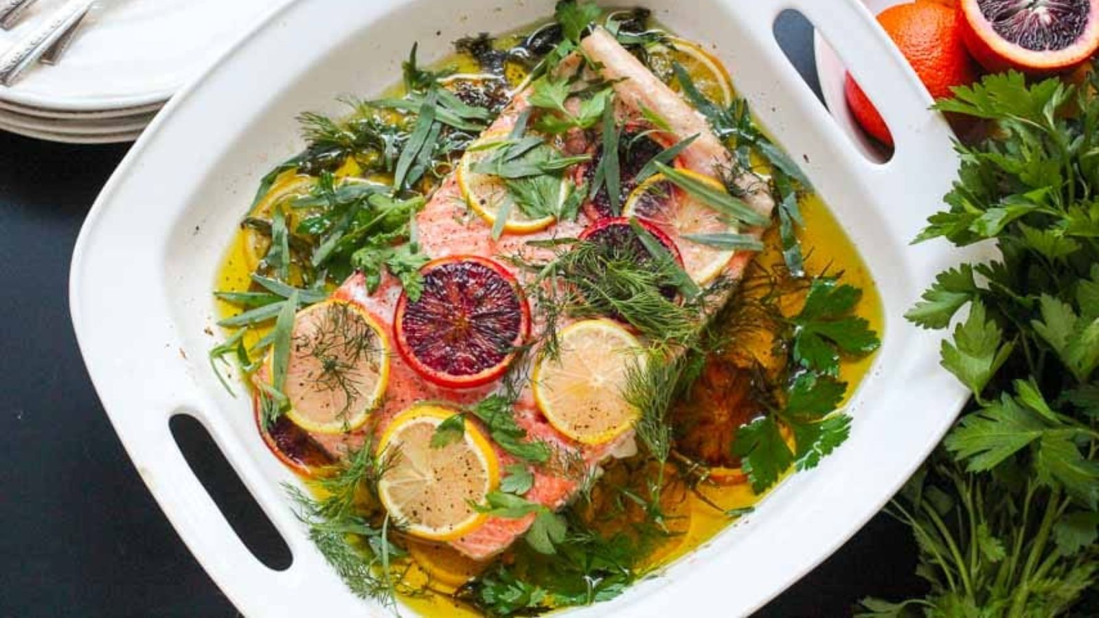 Poached salmon with oil and citrus.
