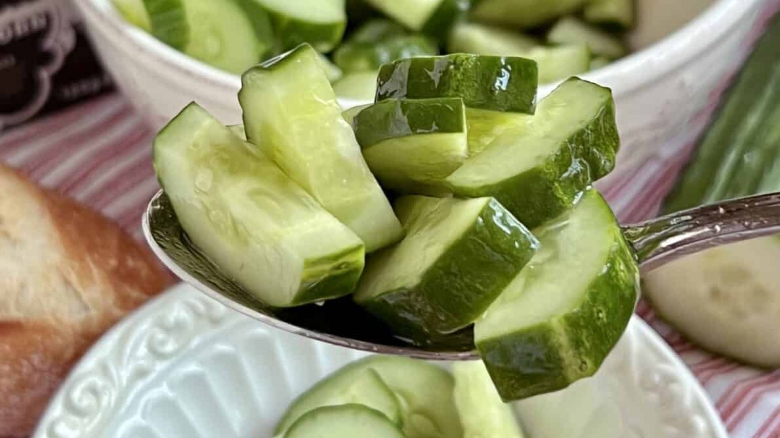 A spoon of sliced cucumber.