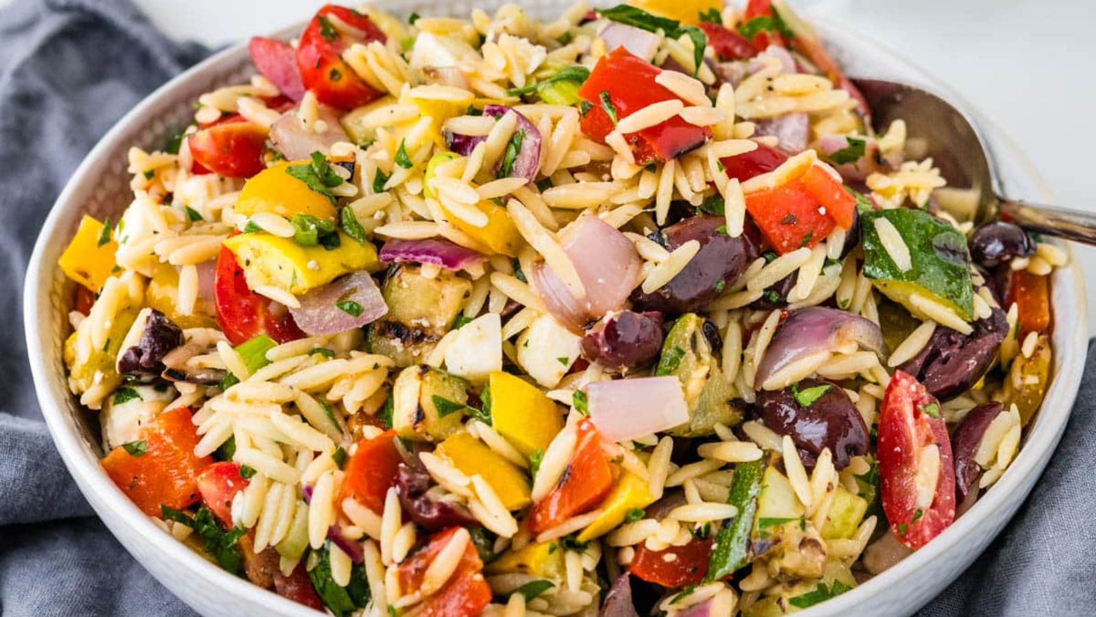 Vegetable salad with orzo pasta.