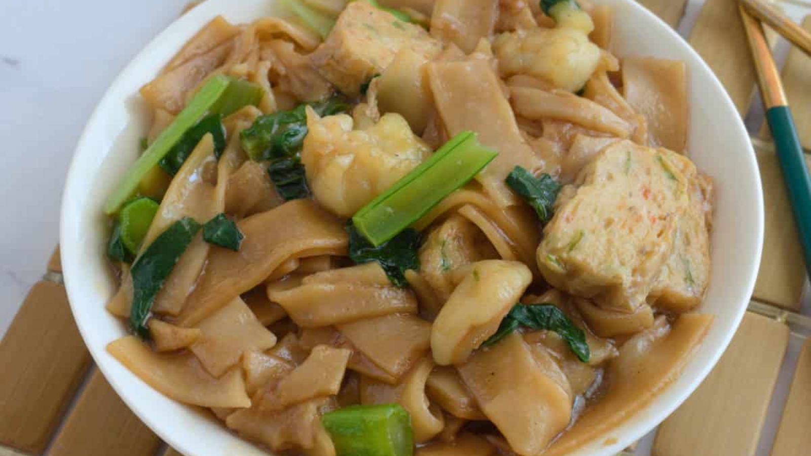 Ho fun noodles in a bowl.