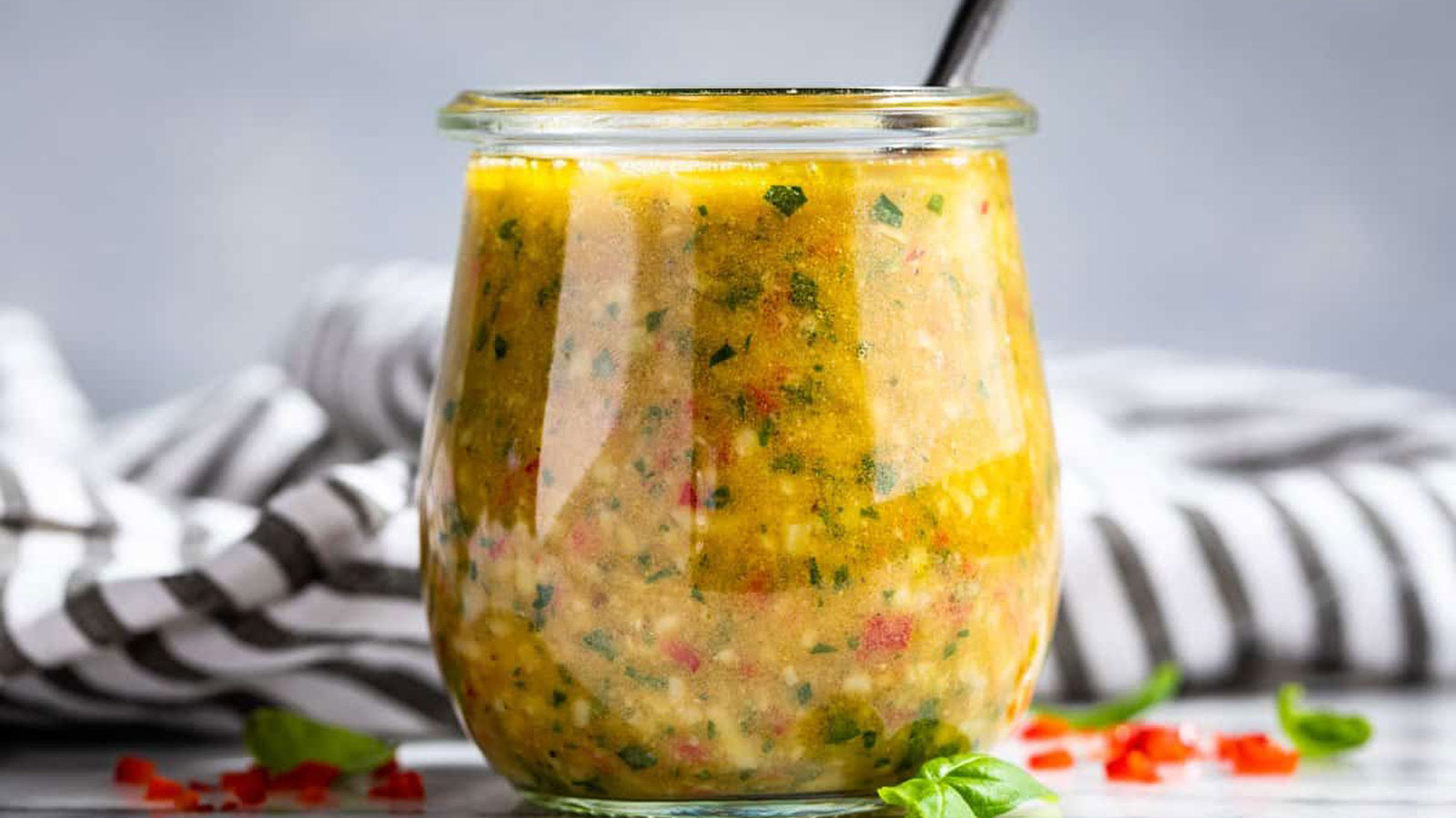 Colorful Italian Dressing in a decorative jar.