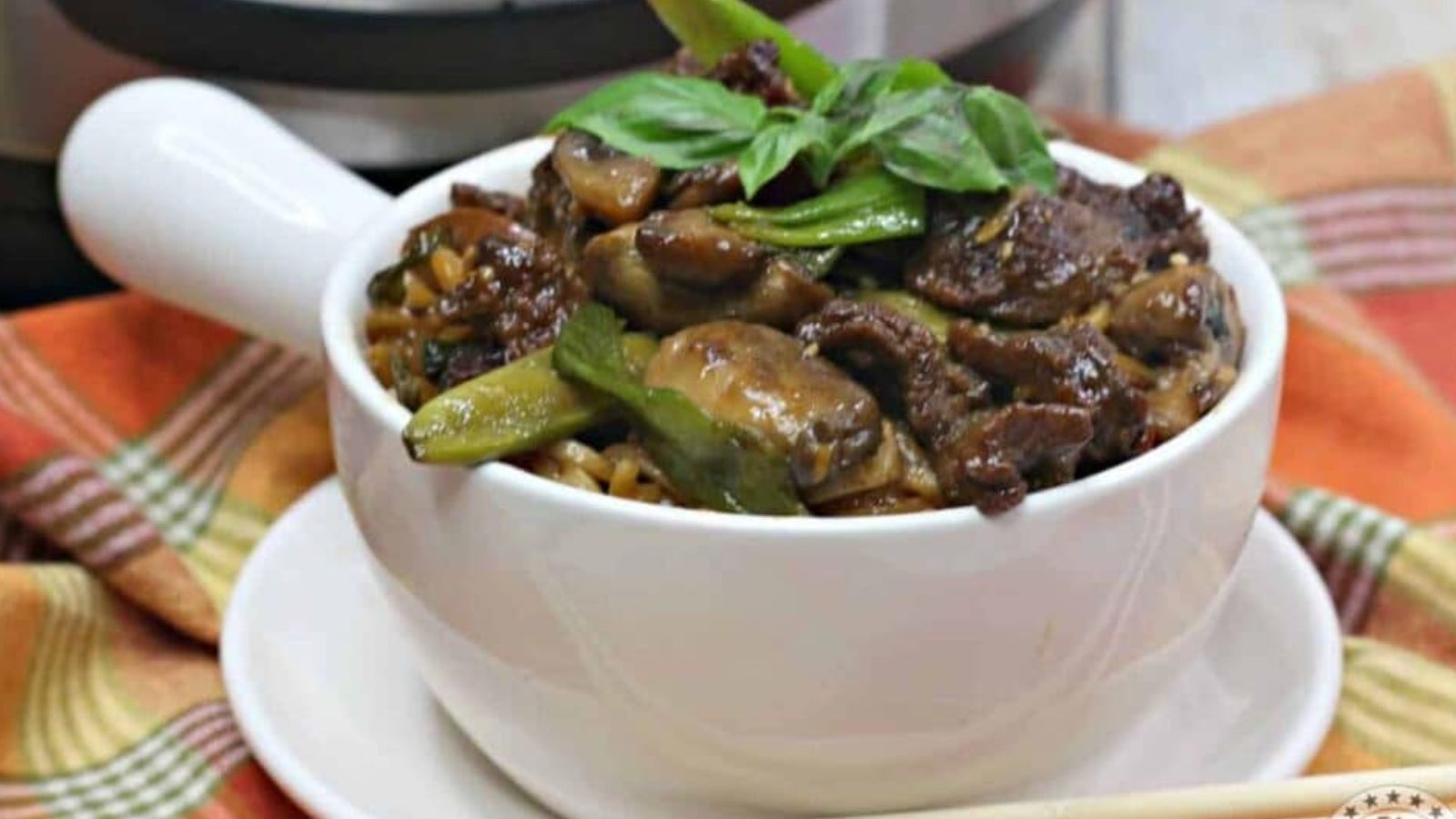 Beef tips and noodles in a bowl.
