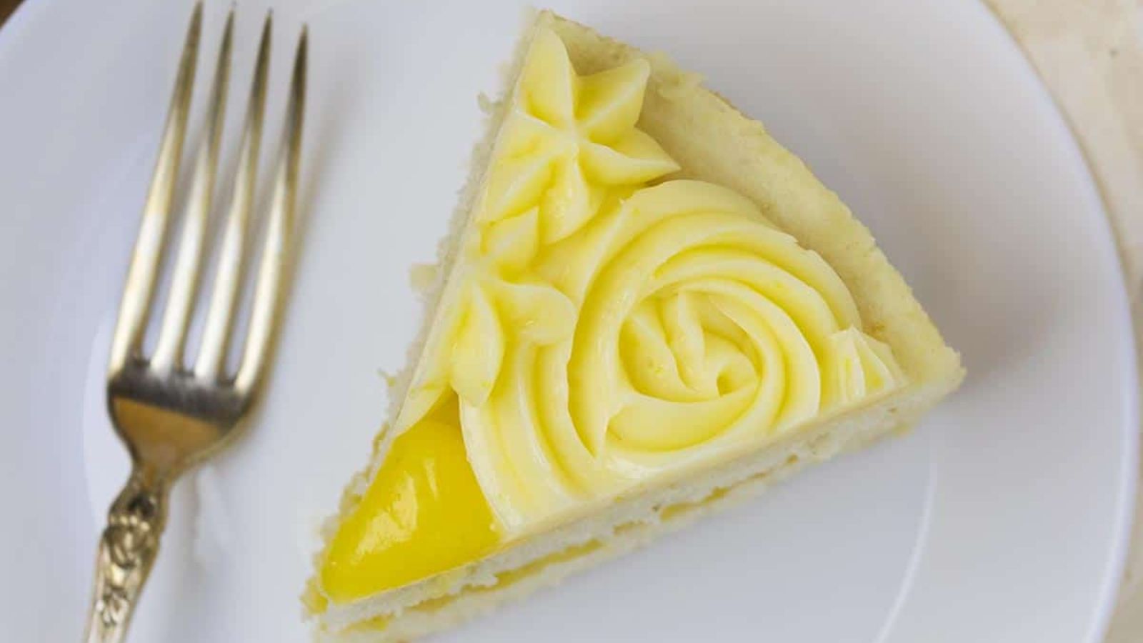 A slice of lemon cake on a plate.