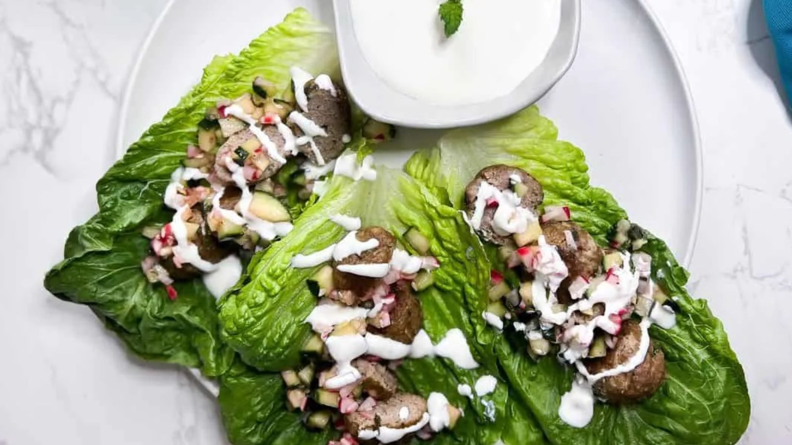 Kofta wraps with dip on the side.