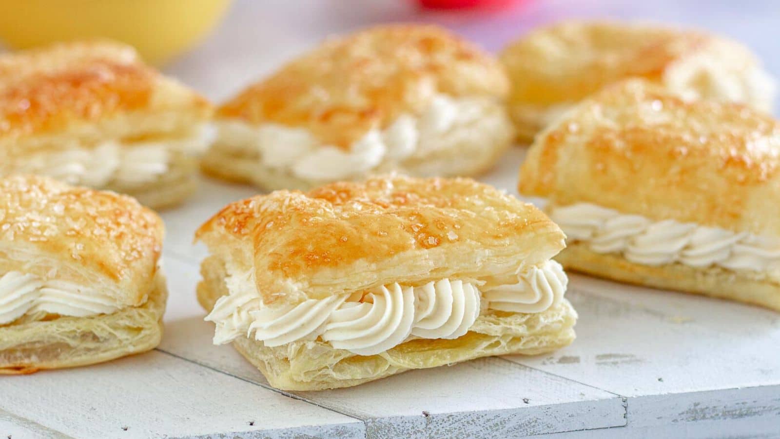 Cream filled horns on a white tray. 