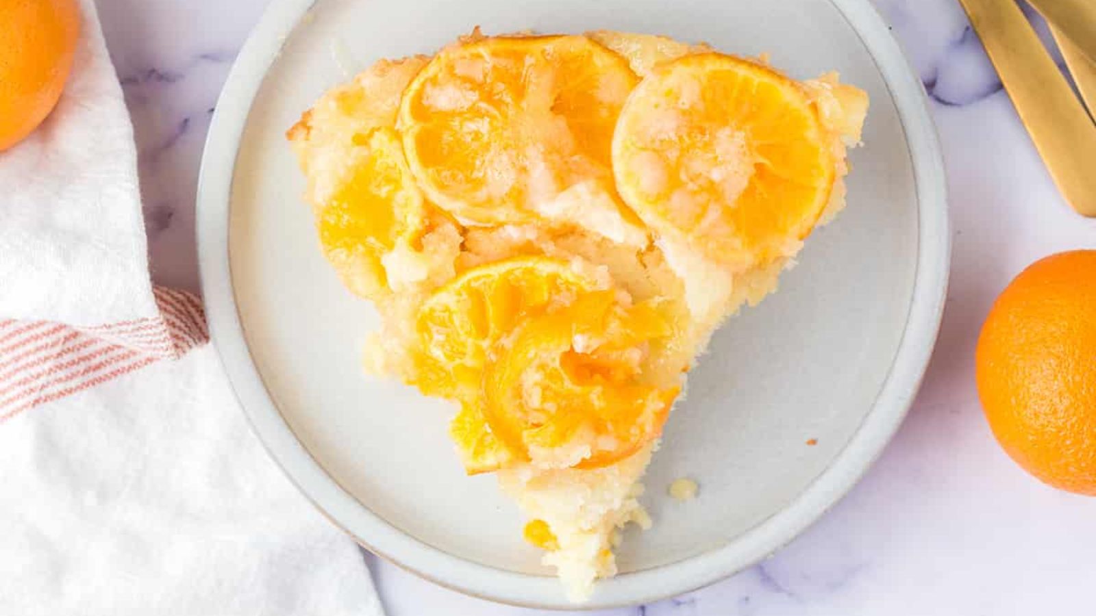A slice of orange upside down cake.
