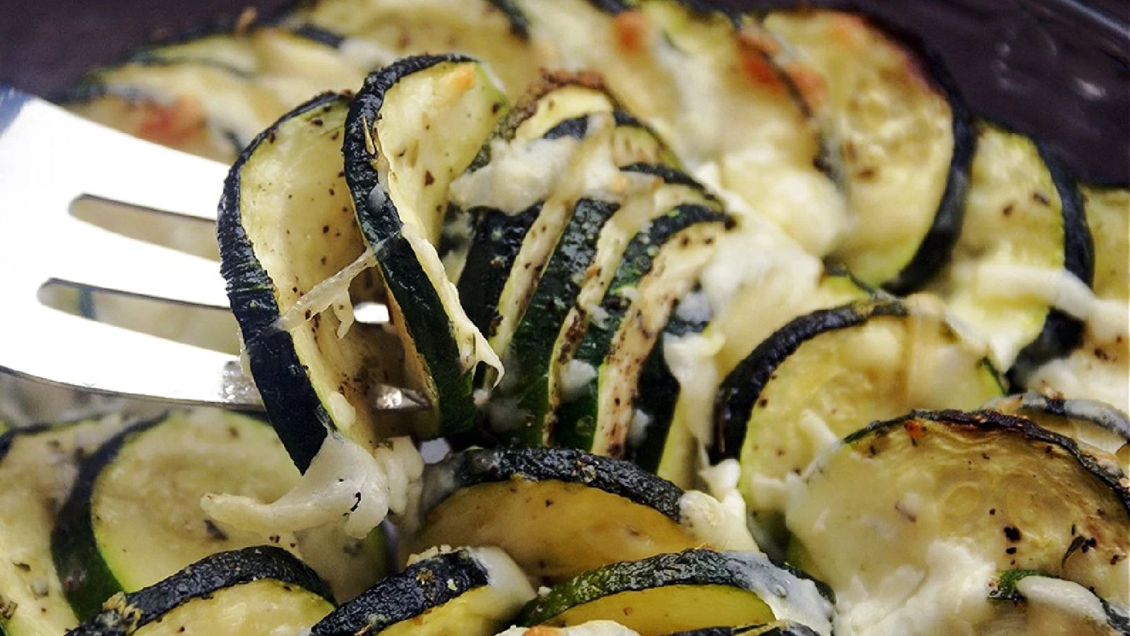 Fork searing roasted parmesan zucchini.