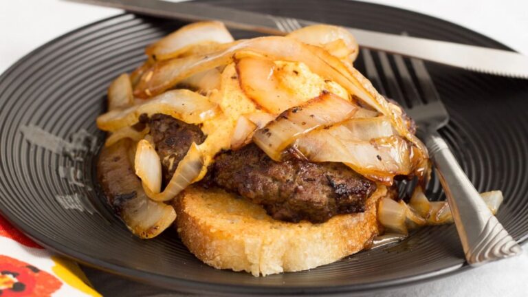 Cheese burger on a plate.