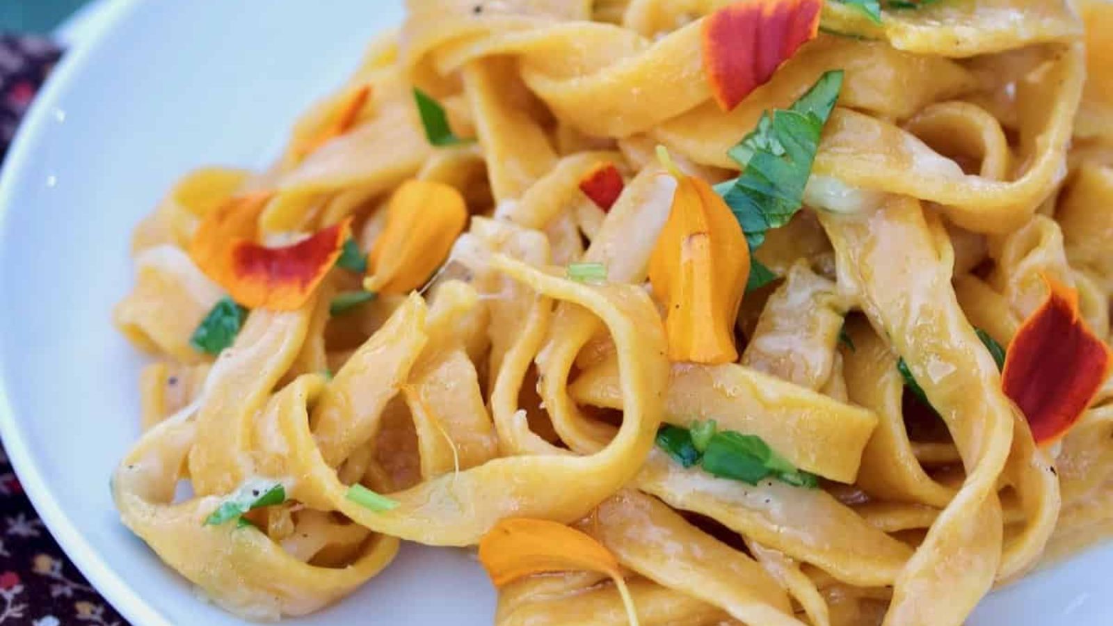 Pumpkin spice pasta on a plate.