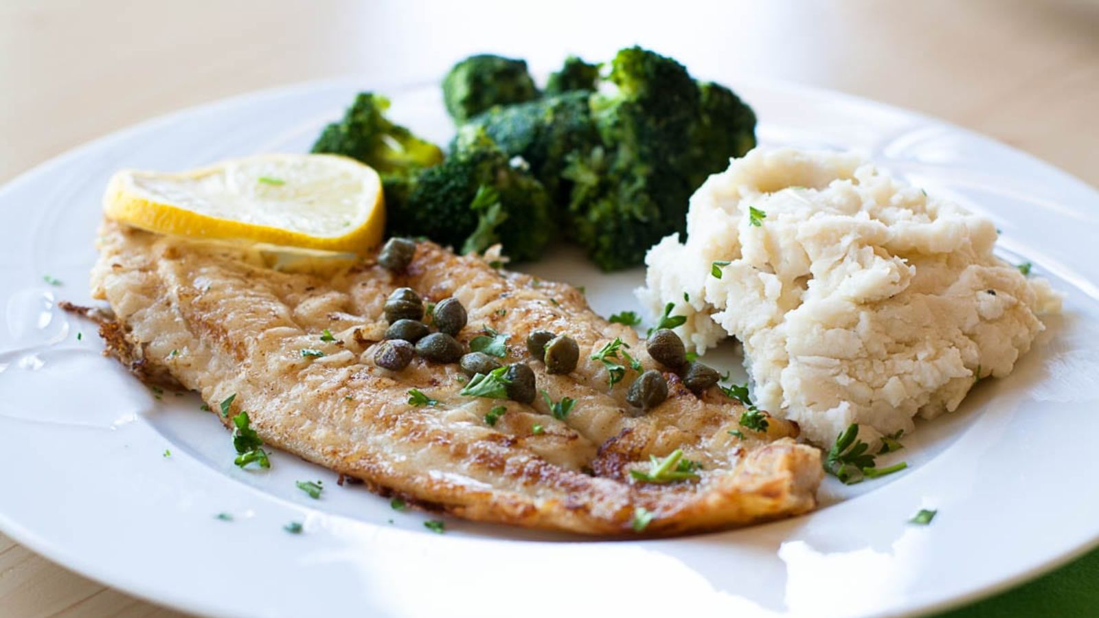 Pan fried dover sole on a plate.