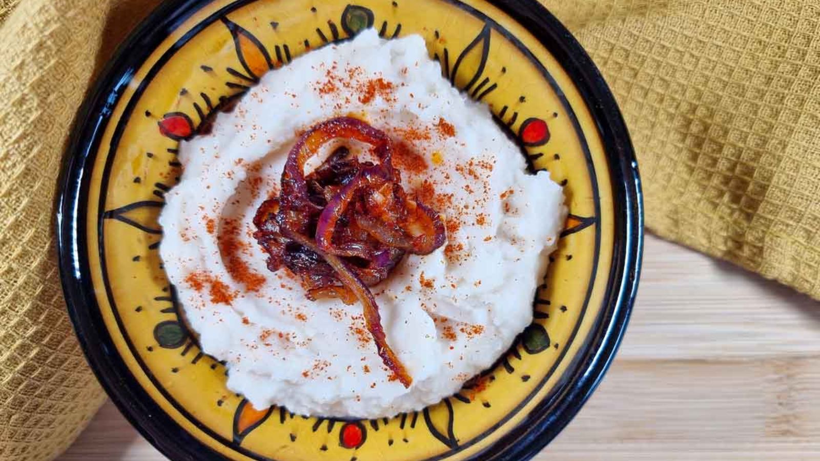 White bean dip on a plate.