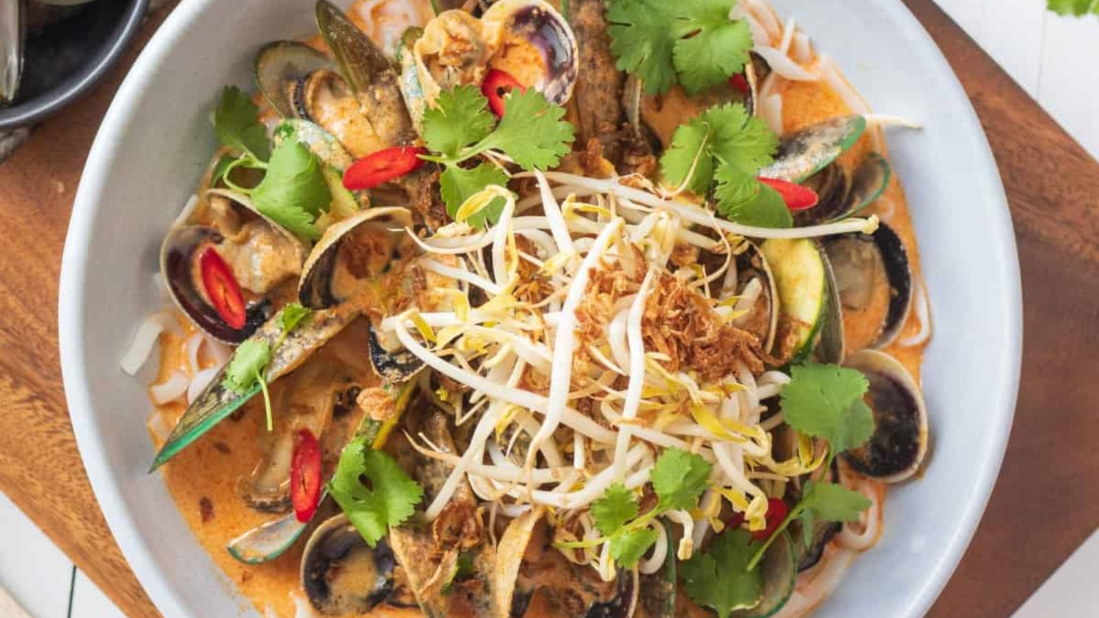 Seafood laksa in a bowl.