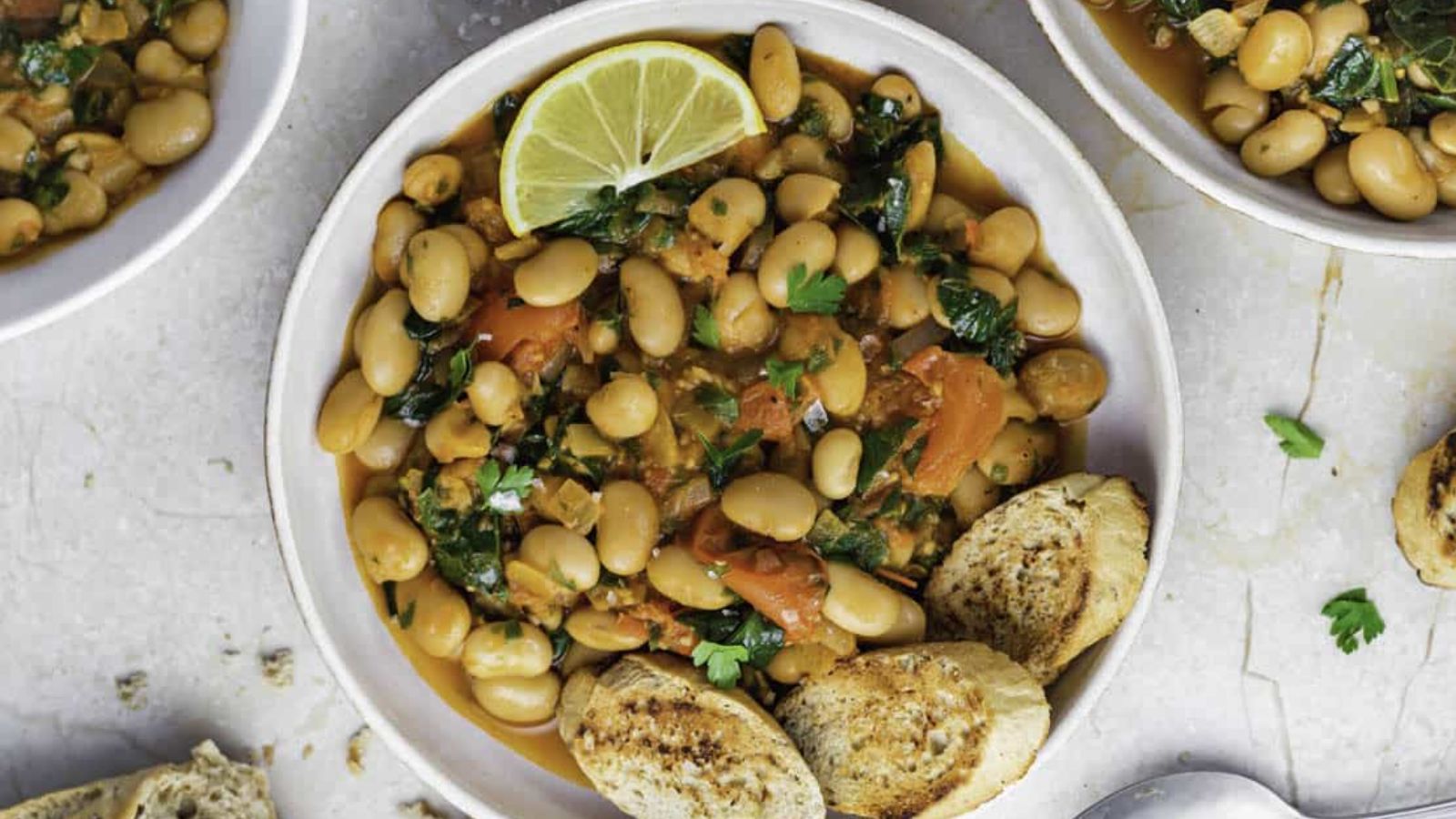 Tomato white bean stew in a bowl.