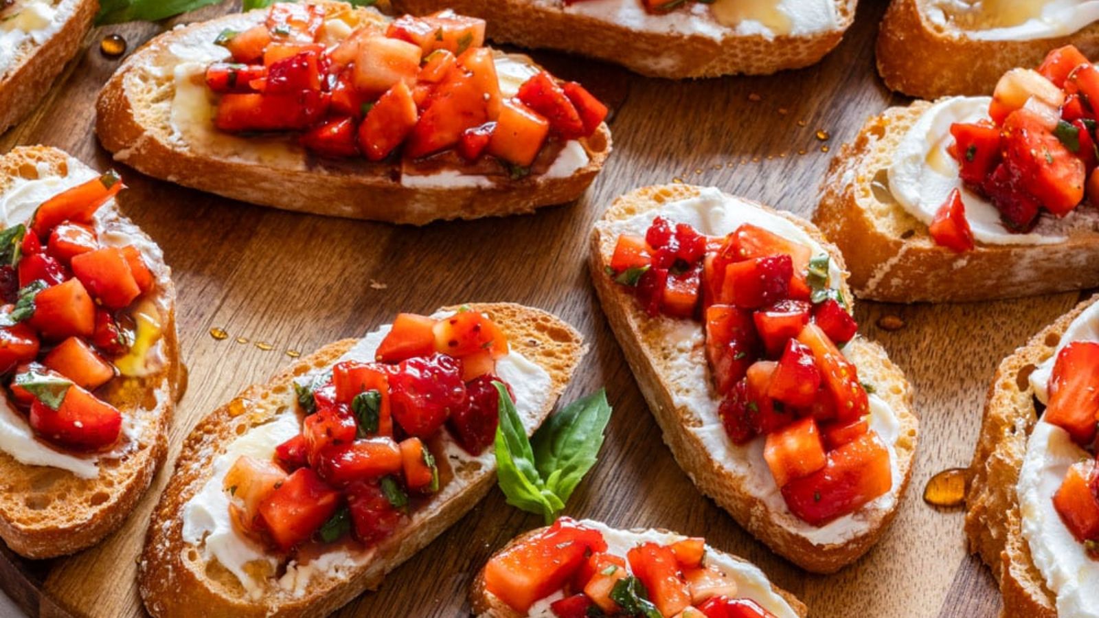 Strawberry bruschetta on a  wooden board.