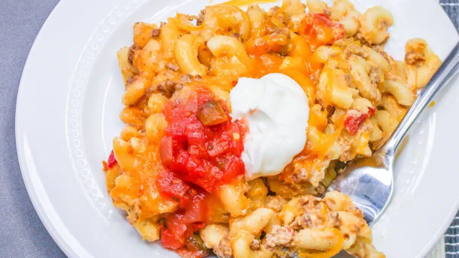 Taco mac and cheese on a plate.