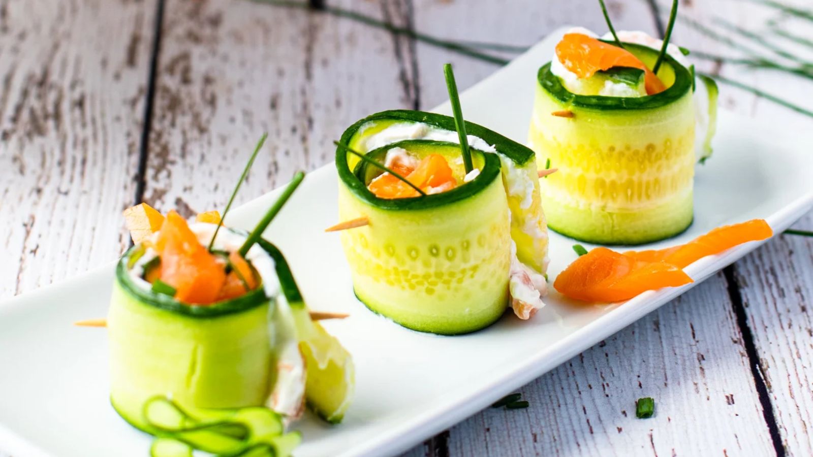 Salmon cucumber appetizers on a plate.
