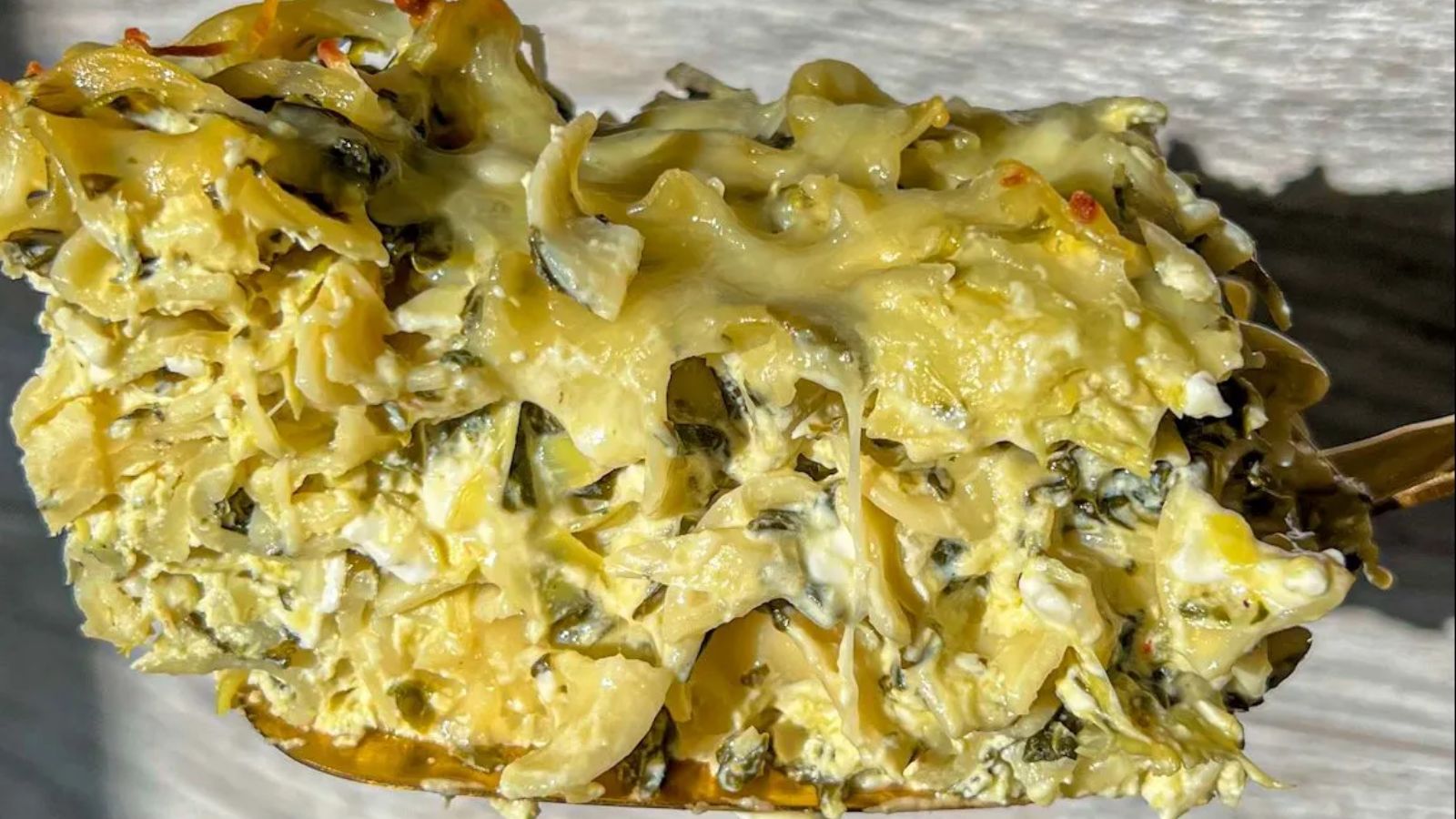 Spinach and artichoke noodle close up shot.