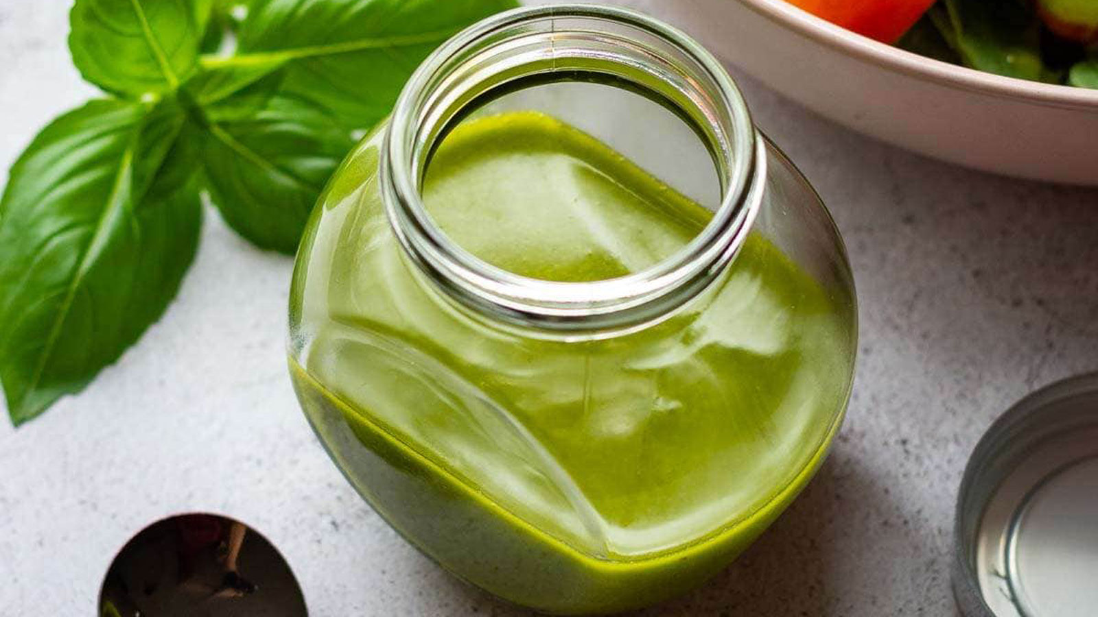 Green dressing in a decorative jar.