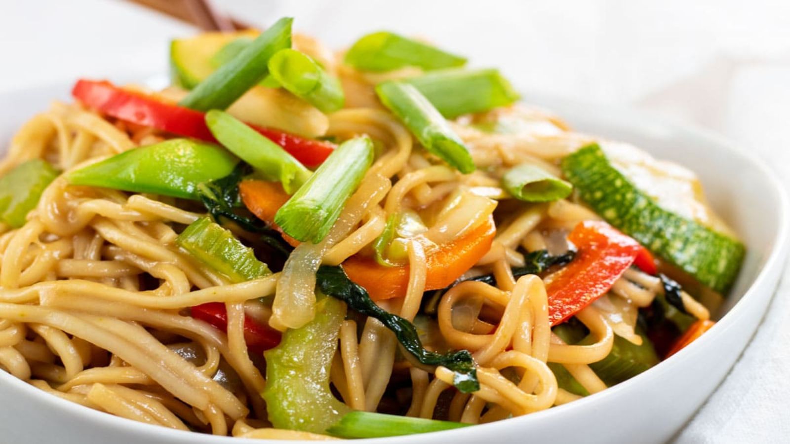 Vegetable lo mein in a bowl.