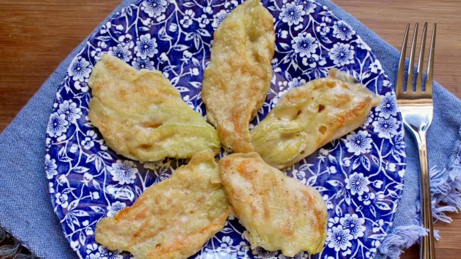 Zucchini flowers on a plate.