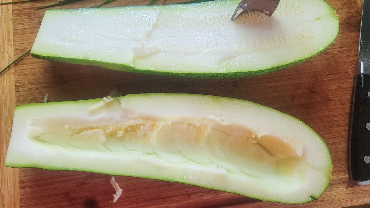 Zucchini cut in half with the seed removed.
