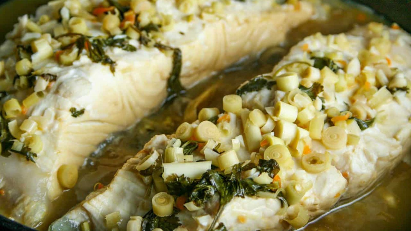Citrus and habanero poached halibut with garlic on top.