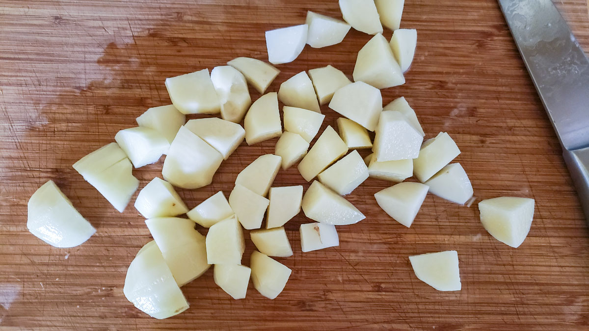 Diced potatoes on a cutting board.