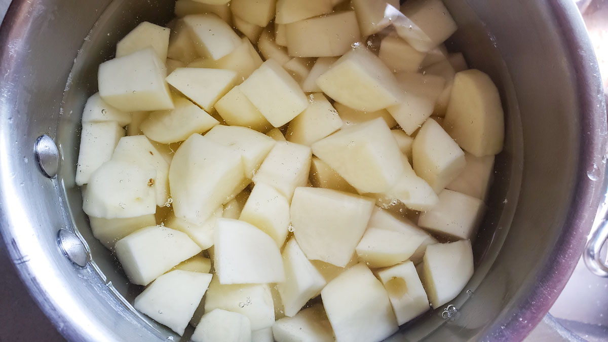 Dicid potatoes in the pot.