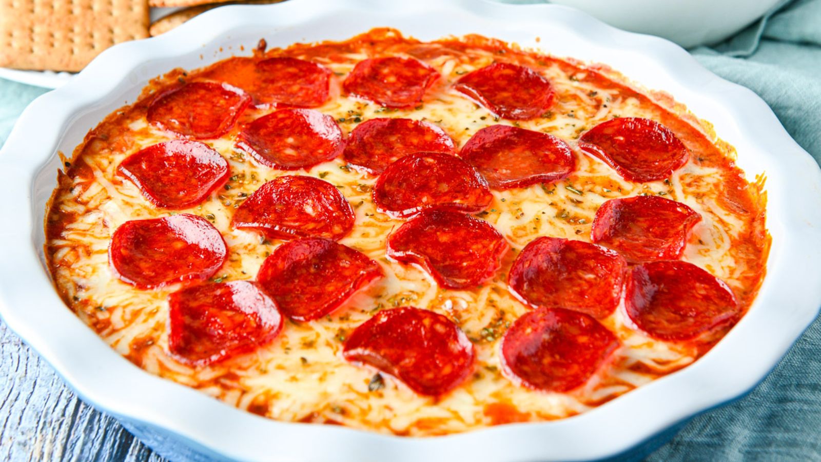 Bowl filled with pepperoni pizza dip.