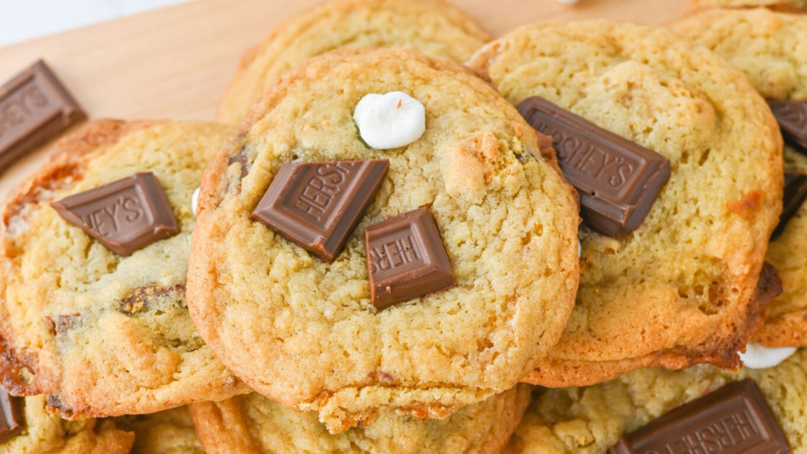 S'mores cookies with chocolates on top.