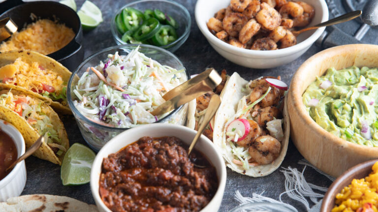 Close up of ingredients on a taco bar.