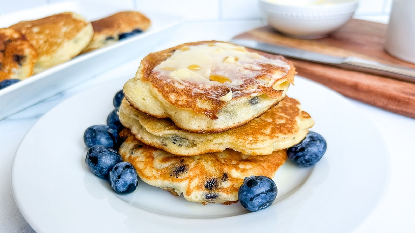 Pancakes with blueberries on the side.