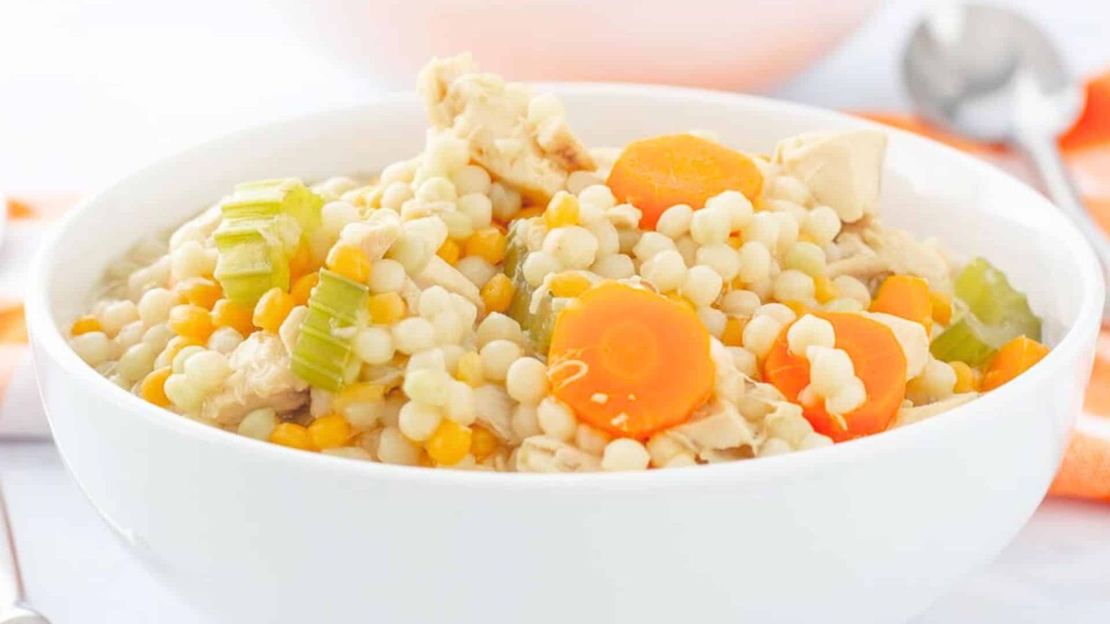 Chicken and pasta soup in a bowl.