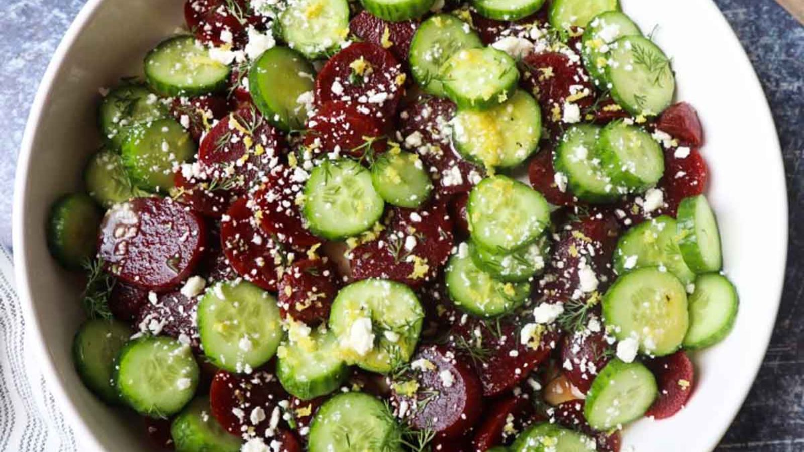 Beet and cucumber salad in a bowl.
