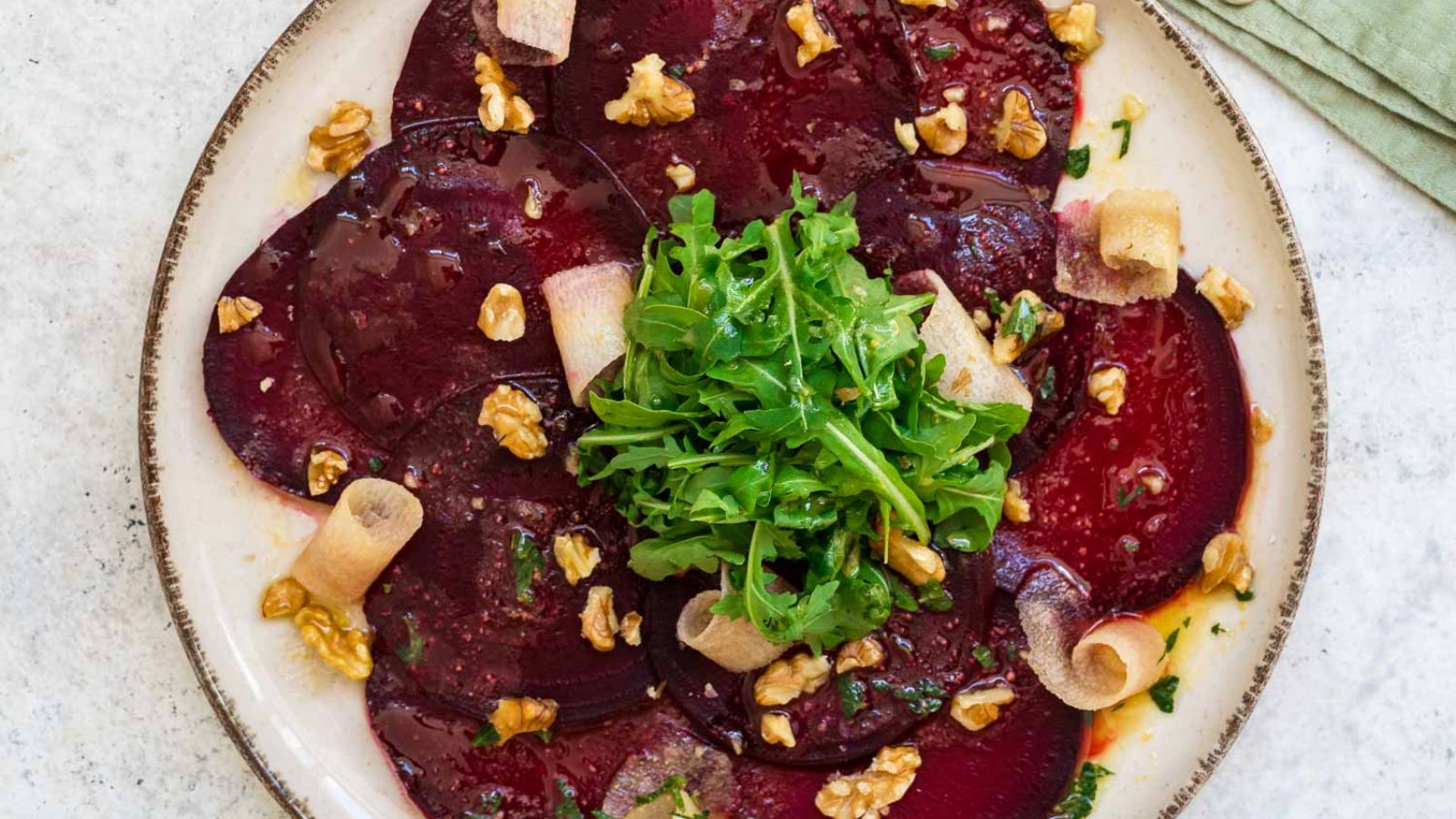 Beetroot carpaccio on a plate.