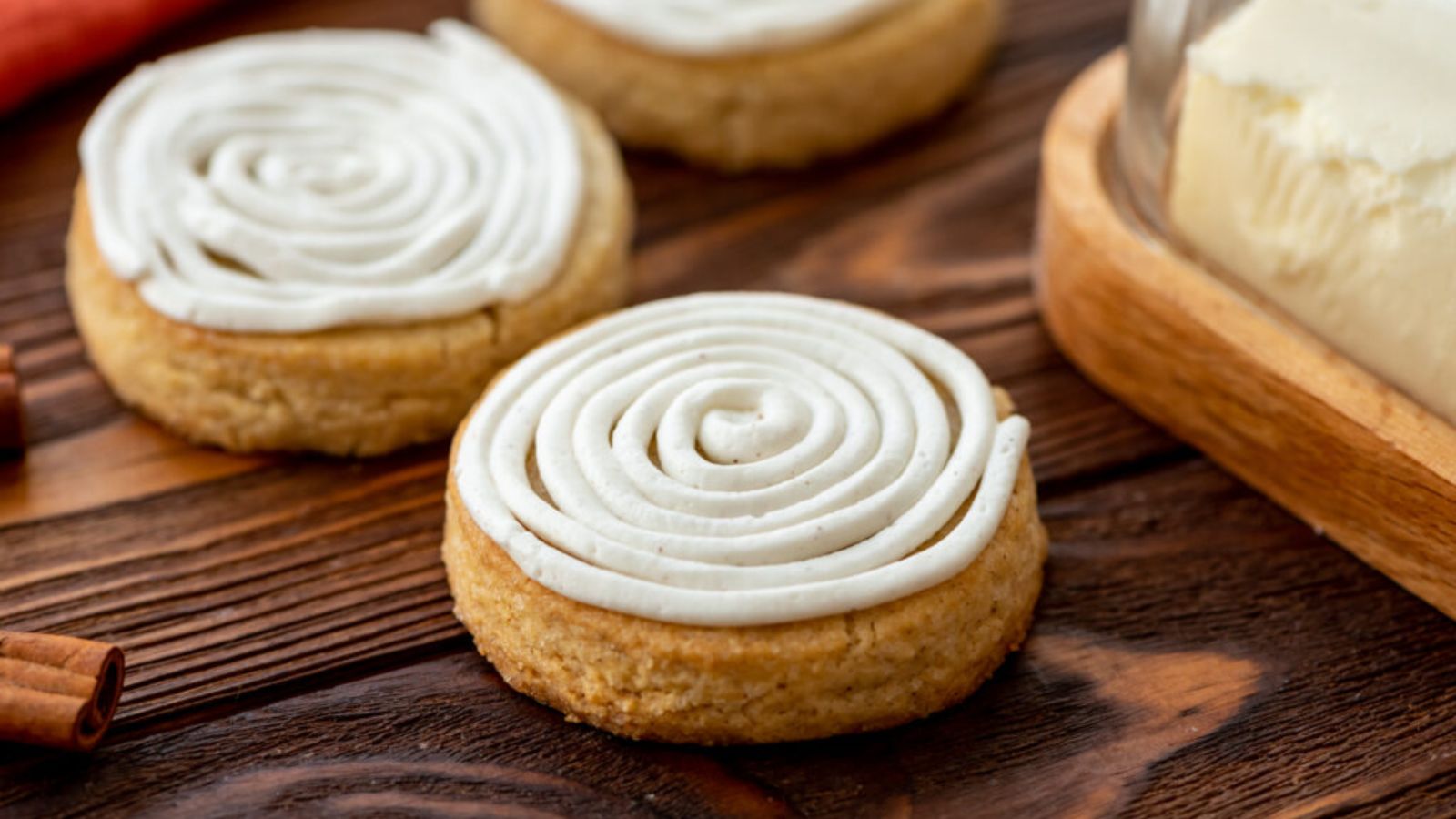 Cinnamon roll sugar cookies on a wooden table.