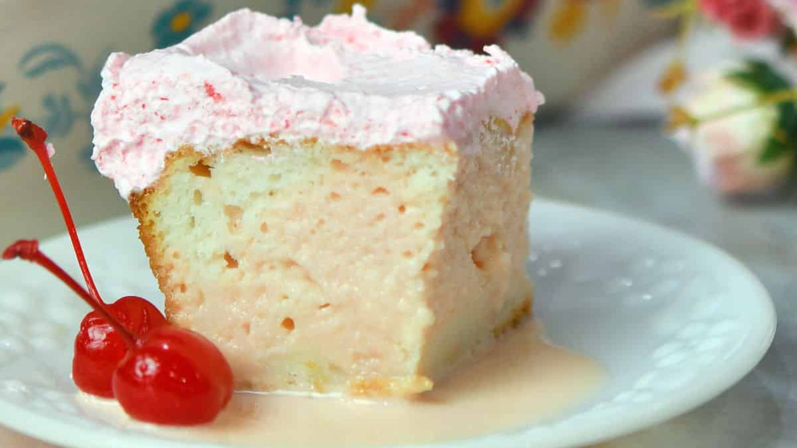 A slice of cherry tres leches cake.
