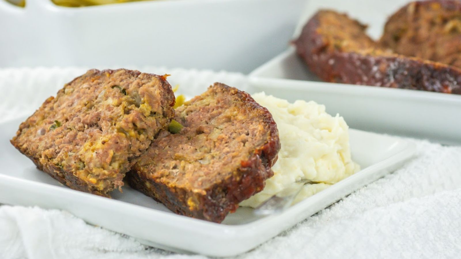 Slices of meatloaf on a plate.