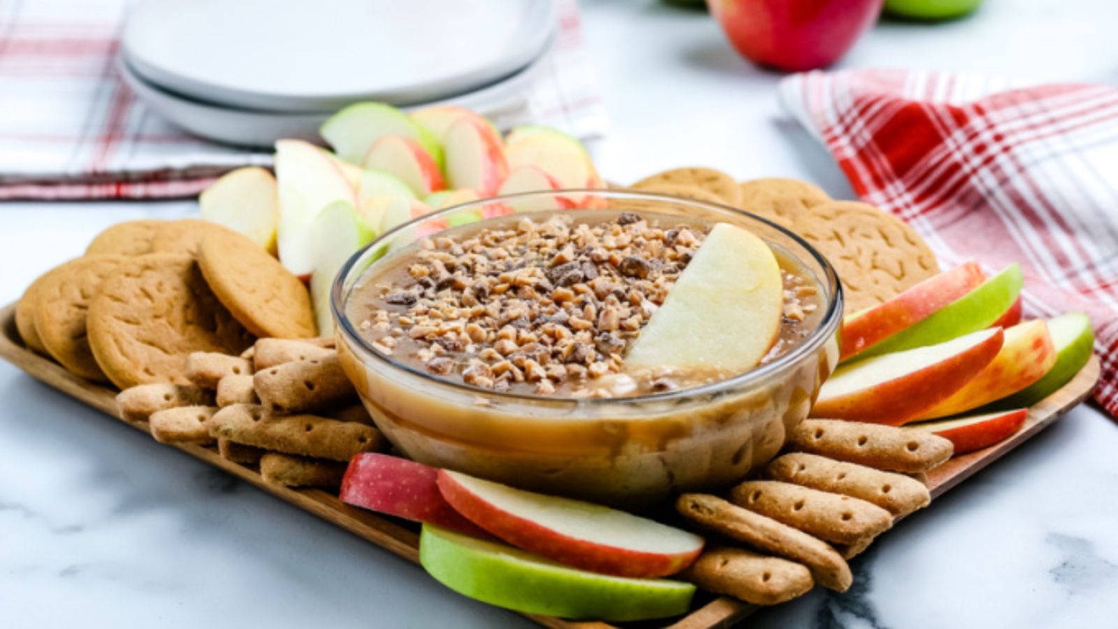 Cream cheese caramel apple dip in a bowl.