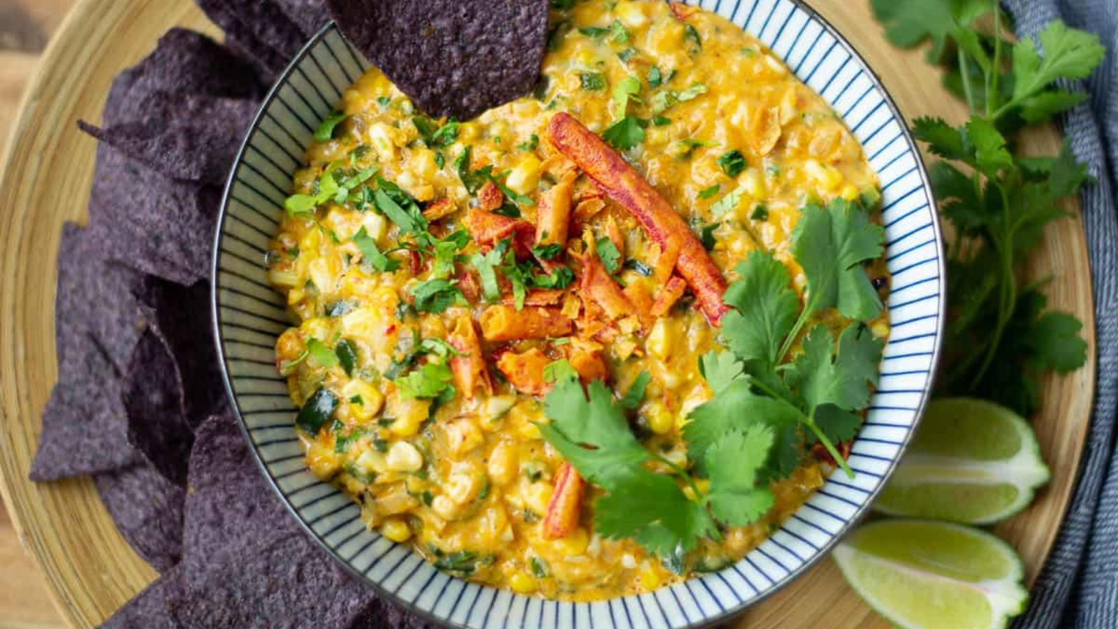 Creamy elote dip in a bowl.